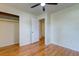 Cozy bedroom featuring hardwood floors, closet, and a ceiling fan at 4327 Bream Rd, North Charleston, SC 29418