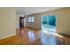 Spacious dining area with hardwood floors, leading to kitchen and backyard at 4327 Bream Rd, North Charleston, SC 29418