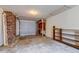 Spacious garage featuring exposed brick wall and shelving units at 4327 Bream Rd, North Charleston, SC 29418