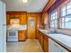 Bright kitchen features wooden cabinets and countertops, complemented by white appliances and linoleum floors at 4327 Bream Rd, North Charleston, SC 29418