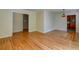 Inviting living room with hardwood floors and view into kitchen at 4327 Bream Rd, North Charleston, SC 29418