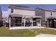Beautiful backyard featuring a screened porch, outdoor kitchen area, and a well-manicured lawn at 4916 Paddy Field Way, Ladson, SC 29456