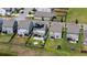 Aerial view of a fenced backyard with a patio, fire pit, and manicured lawn, showcasing outdoor living at 4916 Paddy Field Way, Ladson, SC 29456