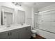 Modern bathroom with double sink vanity, and glass-enclosed shower with tiled walls at 4916 Paddy Field Way, Ladson, SC 29456