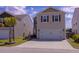 Inviting two-story home with a driveway and manicured lawn in a residential neighborhood at 4916 Paddy Field Way, Ladson, SC 29456