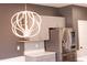 Close-up of a modern kitchen with gray cabinets, stainless steel refrigerator, and stylish backsplash at 4916 Paddy Field Way, Ladson, SC 29456