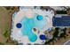 Aerial view of a resort-style pool with lounge chairs, umbrellas, and a spacious deck area at 4916 Paddy Field Way, Ladson, SC 29456