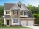 Charming two-story home with a brick and siding exterior, complemented by a well-manicured lawn and a two-car garage at 538 Verdi Dr, Summerville, SC 29486