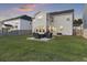 Large backyard with a patio seating area and well-maintained lawn at 555 Dunswell Dr, Summerville, SC 29486