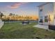 Spacious backyard with a view of the lake, seating and a grill at 555 Dunswell Dr, Summerville, SC 29486
