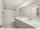 Bathroom featuring double sinks, quartz counters, modern fixtures, and a tub, with elegant style at 555 Dunswell Dr, Summerville, SC 29486
