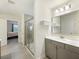 Bathroom with a glass enclosed shower, modern vanity, white walls, and tile floor at 555 Dunswell Dr, Summerville, SC 29486