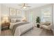 Cozy bedroom featuring soft lighting, a comfortable chair, and artwork on the walls at 555 Dunswell Dr, Summerville, SC 29486