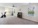 Spacious bonus room with exercise equipment and natural light from the windows at 555 Dunswell Dr, Summerville, SC 29486