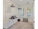 A spacious walk-in closet is shown, complete with custom shelving and hanging racks at 555 Dunswell Dr, Summerville, SC 29486