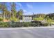 Welcoming community entrance with lush landscaping, beautiful flowers, and attractive signage at 555 Dunswell Dr, Summerville, SC 29486