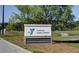 The YMCA's Cane Bay Gathering Center welcome sign is surrounded by lush greenery and landscaping at 555 Dunswell Dr, Summerville, SC 29486