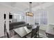 Well-lit dining area features a dark wood table and view into the living room at 555 Dunswell Dr, Summerville, SC 29486