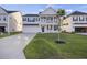 Charming two-story home with a covered front porch, a garage, and a well-manicured lawn at 555 Dunswell Dr, Summerville, SC 29486