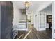 Bright foyer featuring hardwood floors, staircase, and a view into the adjoining room at 555 Dunswell Dr, Summerville, SC 29486