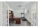 A home office with hardwood flooring, natural lighting, ceiling fan, and French doors at 555 Dunswell Dr, Summerville, SC 29486