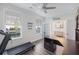Home office including hardwood floors, treadmill, custom desk, and plenty of natural light at 555 Dunswell Dr, Summerville, SC 29486