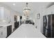 Modern kitchen offers an open view to the living room, featuring a large island and stainless appliances at 555 Dunswell Dr, Summerville, SC 29486