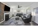 Cozy living room with fireplace, large sectional sofa, and wood accent wall at 555 Dunswell Dr, Summerville, SC 29486