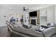 Spacious living room with a fireplace, large sectional sofa and open access to the kitchen at 555 Dunswell Dr, Summerville, SC 29486