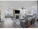 Spacious living room featuring a fireplace with a large screen television and leather furniture at 555 Dunswell Dr, Summerville, SC 29486