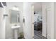 Traditional powder room features a pedestal sink and opens to the living room at 555 Dunswell Dr, Summerville, SC 29486