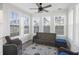 Bright sunroom with lots of natural light featuring a ceiling fan, and wicker furniture at 555 Dunswell Dr, Summerville, SC 29486