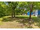 Expansive backyard featuring mature trees and landscaping at 6035 Bay Pond Rd, Ravenel, SC 29470
