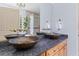 Elegant bathroom with granite counters and custom vessel sinks at 6035 Bay Pond Rd, Ravenel, SC 29470