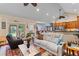 Bright living room featuring hardwood floors, modern furniture, and open floor plan at 6035 Bay Pond Rd, Ravenel, SC 29470