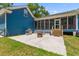 Back patio featuring a grill, fire pit, and access to the screened-in porch at 6035 Bay Pond Rd, Ravenel, SC 29470
