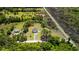 Aerial view showcasing property lines, house, and surrounding wooded landscape at 795 Shagule Rd, Edisto Island, SC 29438