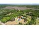Aerial view of a home surrounded by lush greenery and waterfront views at 795 Shagule Rd, Edisto Island, SC 29438