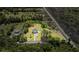 Aerial view with property lines, house, lush lawn and surrounding trees at 795 Shagule Rd, Edisto Island, SC 29438