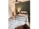 Inviting bedroom with stylish wall paneling, soft lighting, and a neutral color scheme, creating a cozy retreat at 795 Shagule Rd, Edisto Island, SC 29438