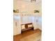 Well-organized entryway with coat racks, storage cabinets, a bench, and a jute rug, maximizing space and style at 795 Shagule Rd, Edisto Island, SC 29438