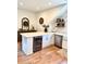 Bright and open kitchen features a central island with seating, white cabinets, and modern stainless steel appliances at 795 Shagule Rd, Edisto Island, SC 29438