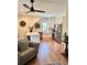 Modern kitchen with white cabinets, stainless steel appliances, and stylish lighting, seamlessly blending with the living area at 795 Shagule Rd, Edisto Island, SC 29438
