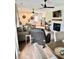 Open-concept living room with fireplace and an adjacent kitchen, offering a seamless flow for entertaining at 795 Shagule Rd, Edisto Island, SC 29438