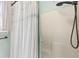 Close up of white shower and black hardware at 828 Williamsburg Ln, Charleston, SC 29414