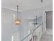 Open foyer featuring staircase, modern lighting, and views of the front entrance at 828 Williamsburg Ln, Charleston, SC 29414