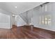 Bright living room with hardwood floors, soaring ceilings, and a staircase to the second floor at 828 Williamsburg Ln, Charleston, SC 29414
