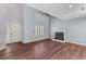 Open-concept living space with hardwood floors, a fireplace and tons of natural light at 828 Williamsburg Ln, Charleston, SC 29414