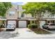 Attractive townhome with a brick facade, attached garage, and well-maintained landscaping at 8676 Grassy Oak Trl, North Charleston, SC 29420
