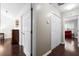 Hallway with hardwood floors that leads to the bedrooms and closets at 8676 Grassy Oak Trl, North Charleston, SC 29420
